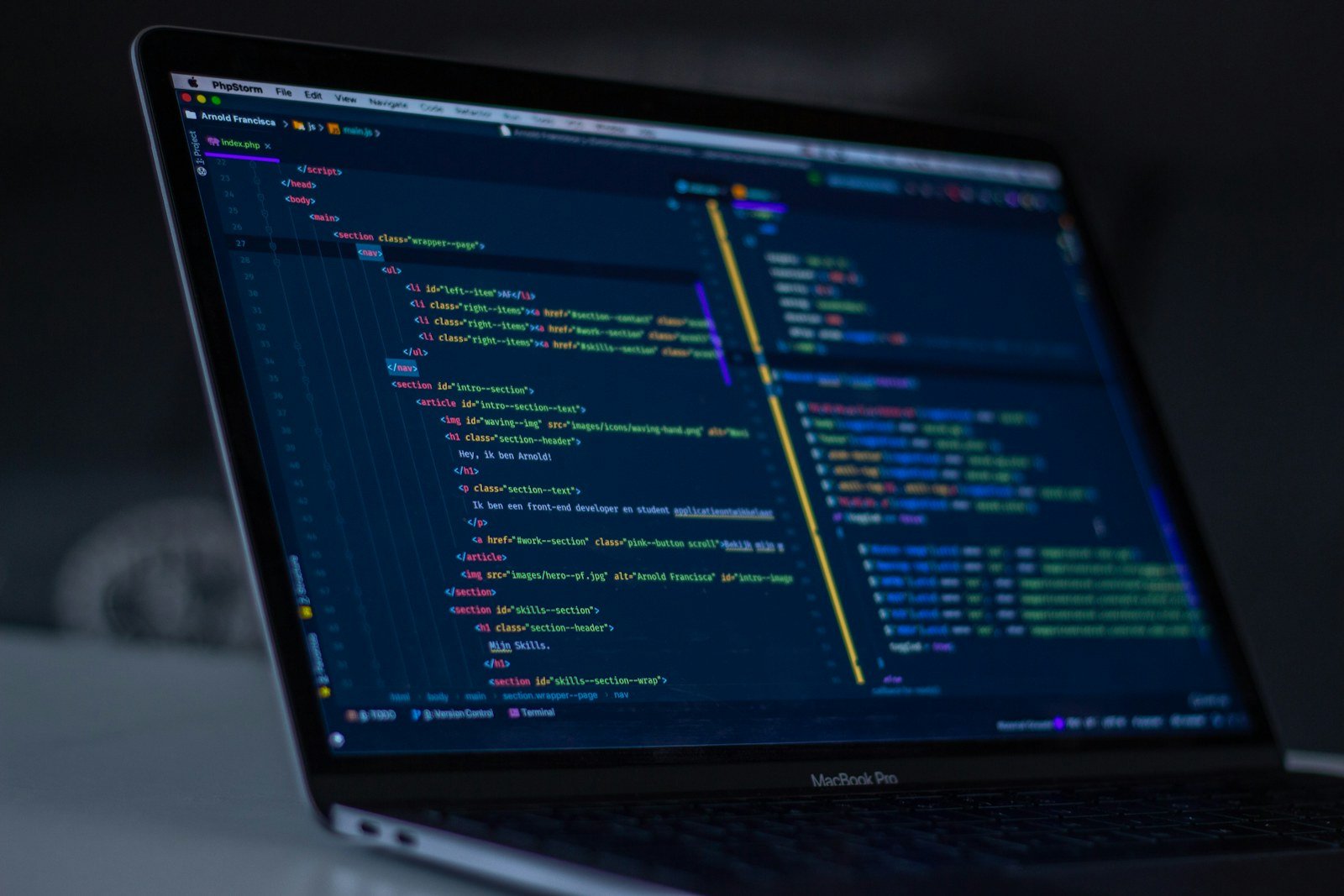 Software code displayed on a developer laptop