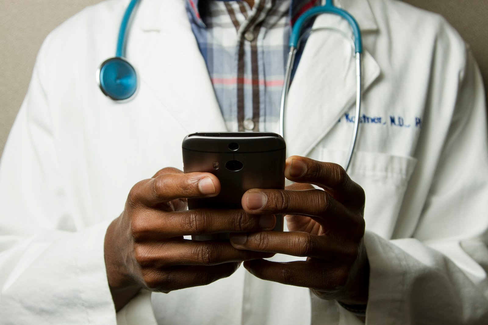 Healthcare professional using a mobile phone